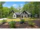 Beautiful home showcasing black and white exterior design and lush landscaping at 88 Priscilla Ln, Fuquay Varina, NC 27526