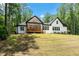 Beautiful back exterior view of the house with a covered porch and a well-maintained lawn at 88 Priscilla Ln, Fuquay Varina, NC 27526