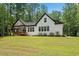Charming exterior view of the house with a sprawling lawn and a covered back porch at 88 Priscilla Ln, Fuquay Varina, NC 27526