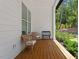 Cozy front porch with comfortable seating and a serene view of the surrounding nature at 88 Priscilla Ln, Fuquay Varina, NC 27526