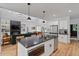 Stylish kitchen with a large island, stainless steel appliances, and an open layout to the living area at 88 Priscilla Ln, Fuquay Varina, NC 27526