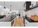 Well-designed kitchen featuring stainless steel appliances, an island, and views of the backyard at 88 Priscilla Ln, Fuquay Varina, NC 27526