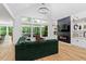 Elegant living room featuring modern lighting, a cozy fireplace, and panoramic views at 88 Priscilla Ln, Fuquay Varina, NC 27526