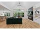 Spacious living room with a fireplace, stylish decor, and floor-to-ceiling windows at 88 Priscilla Ln, Fuquay Varina, NC 27526