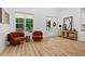 Bright living room with hardwood floors, comfortable seating, and ample natural light at 88 Priscilla Ln, Fuquay Varina, NC 27526