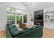 Comfortable living room with stylish decor, a modern fireplace, and expansive windows at 88 Priscilla Ln, Fuquay Varina, NC 27526