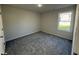 Bedroom with window and carpet at 91 Oakfield Trace Dr, Four Oaks, NC 27524