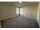 Bedroom with window and carpet at 91 Oakfield Trace Dr, Four Oaks, NC 27524