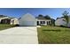Charming single-story home with a two-car garage, inviting front porch, and well-maintained lawn at 91 Oakfield Trace Dr, Four Oaks, NC 27524