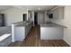Modern kitchen with granite countertops, stainless appliances, and a breakfast bar at 91 Oakfield Trace Dr, Four Oaks, NC 27524