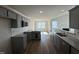 Contemporary kitchen featuring gray cabinets and stainless steel appliances at 91 Oakfield Trace Dr, Four Oaks, NC 27524