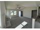 Bright living room featuring neutral carpet, a ceiling fan, a fireplace, and plenty of natural light at 91 Oakfield Trace Dr, Four Oaks, NC 27524