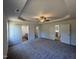 Spacious main bedroom showcases a tray ceiling, ceiling fan, and adjoins a bathroom and walk-in closet at 91 Oakfield Trace Dr, Four Oaks, NC 27524