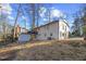 Expansive backyard featuring a deck and shed, perfect for outdoor enjoyment and storage at 947 Manchester Dr, Cary, NC 27511