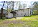 Spacious backyard with a deck, shed and lush landscaping at 947 Manchester Dr, Cary, NC 27511