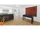 Spacious finished basement with wood floors, foosball table, and neutral paint at 947 Manchester Dr, Cary, NC 27511