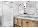 This bathroom features double vanity sinks and a modern glass shower stall at 947 Manchester Dr, Cary, NC 27511