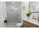 Modern bathroom with glass shower, updated vanity, and designer touches at 947 Manchester Dr, Cary, NC 27511