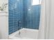 Close up of a bathtub with white tiling and a chrome faucet at 947 Manchester Dr, Cary, NC 27511