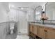 Updated bathroom showcasing a glass shower, dual sinks, and a stylish vanity with decor at 947 Manchester Dr, Cary, NC 27511