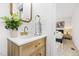 Bathroom vanity with modern fixtures and views to the bedroom at 947 Manchester Dr, Cary, NC 27511
