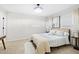 This primary bedroom features neutral colors, natural lighting, and a ceiling fan at 947 Manchester Dr, Cary, NC 27511