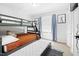 Bedroom with bunkbeds, trundle bed, window, blue curtains, and carpet at 947 Manchester Dr, Cary, NC 27511