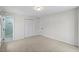 Neutral bedroom featuring carpeted floors, closet, and ample natural light at 947 Manchester Dr, Cary, NC 27511