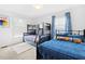 Bright bedroom features a bunk bed, a twin bed and large window at 947 Manchester Dr, Cary, NC 27511