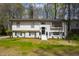 Charming two-story home with a beautifully landscaped front yard and classic design at 947 Manchester Dr, Cary, NC 27511