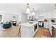 Contemporary kitchen featuring a white island, stainless steel appliances, and bar stool seating at 947 Manchester Dr, Cary, NC 27511