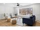 Comfortable living room features hardwood floors, large windows, and modern furnishings at 947 Manchester Dr, Cary, NC 27511