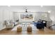 Bright living room with hardwood floors, large windows, and stylish furnishings at 947 Manchester Dr, Cary, NC 27511