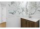 Stylish powder room featuring modern wallpaper, a round mirror, and updated fixtures at 947 Manchester Dr, Cary, NC 27511