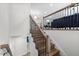 Elegant staircase features wood treads, white risers, and decorative iron railing at 947 Manchester Dr, Cary, NC 27511