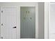 Stylish wall decor featuring a minimalist design and modern accents, next to a white door at 947 Manchester Dr, Cary, NC 27511