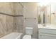 Bathroom showcasing tile flooring, a shower-tub combo, a vanity with a mirror, and a toilet at 996 Tender Dr, Apex, NC 27502