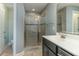 Modern bathroom featuring a glass shower and a sleek vanity with a white countertop at 996 Tender Dr, Apex, NC 27502