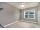 Bright bedroom with neutral walls, carpet flooring, a ceiling fan, and a window at 996 Tender Dr, Apex, NC 27502