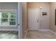 Inviting entryway featuring stylish flooring, a bright window, and a welcoming atmosphere at 996 Tender Dr, Apex, NC 27502
