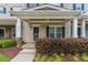Charming covered front porch with tasteful landscaping, stylish columns, and inviting entryway at 996 Tender Dr, Apex, NC 27502