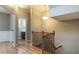 Inviting hallway featuring hardwood floors, elegant staircase, and access to rooms for easy navigation at 996 Tender Dr, Apex, NC 27502
