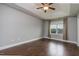 Bright main bedroom with a trey ceiling, hardwood floors, large window, and neutral decor for a peaceful retreat at 996 Tender Dr, Apex, NC 27502