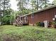 Spacious backyard with lawn and a deck accessible from the house at 100 Upton Ct, Garner, NC 27529