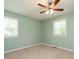 Cozy bedroom with carpet, natural light from two windows, and a ceiling fan at 100 Upton Ct, Garner, NC 27529