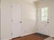 Bright entryway features hardwood floors, a glass-paneled door, and a neutral color palette at 100 Upton Ct, Garner, NC 27529