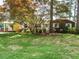Charming single-story home featuring a well-maintained lawn, mature trees, and a welcoming facade at 100 Upton Ct, Garner, NC 27529