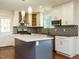 Kitchen area showcasing island, stainless appliances, and decoratvie backsplash at 100 Upton Ct, Garner, NC 27529