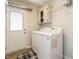 Laundry room with washer, dryer, overhead cabinets and access to exterior at 100 Upton Ct, Garner, NC 27529
