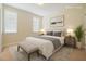 Bedroom with a queen bed, neutral bedding, accent pillows, and matching bedside tables at 1016 Pasture View Ln, Raleigh, NC 27603